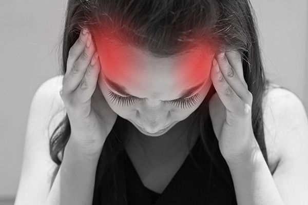 image of a person suffering from a migraine
